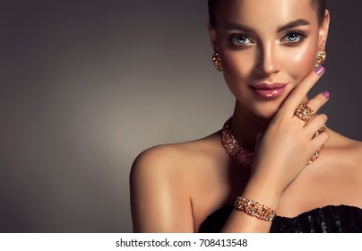Beautiful girl with jewelry . A set of jewelry for woman ,necklace ,earrings and bracelet. Beauty and accessories.  bijouterie