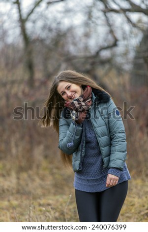 beautiful girl in the late autumn nature