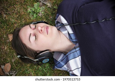 Beautiful girl listen to music with headphones