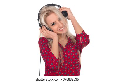 Beautiful girl listens to music on headphones