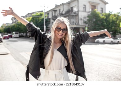 A Beautiful Girl With Long Even Hair Walks Around The City, The Model Is Wearing A Black Braid And White Trousers