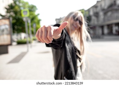 A Beautiful Girl With Long Even Hair Walks Around The City, The Model Is Wearing A Black Braid And White Trousers