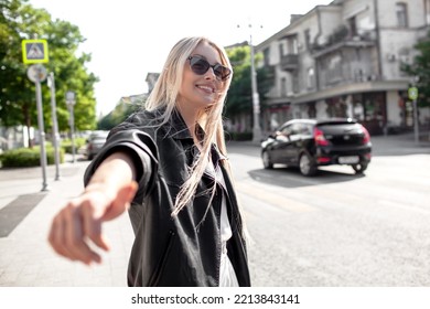 A Beautiful Girl With Long Even Hair Walks Around The City, The Model Is Wearing A Black Braid And White Trousers