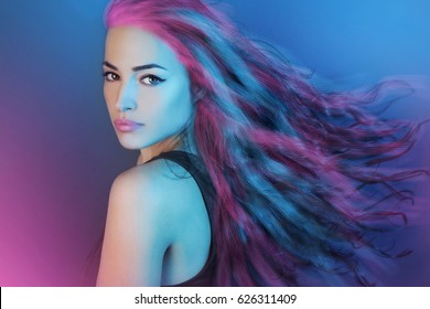 beautiful girl with long flying hair, artistic colorful portrait
