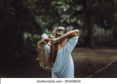 Beautiful Girl With Long Hair Braids Hair Spike. Beautiful Girl Braids Hair Before Surfing