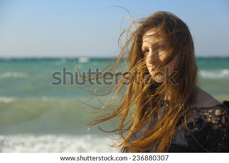 Similar – Portrait of a young woman on the beach