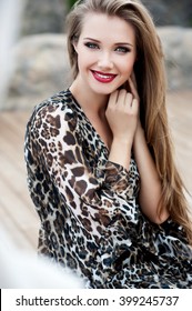 Beautiful girl with long hair. Smiling girl. Young pretty woman with beautiful long hairs and red lips