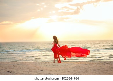 red dress on beach