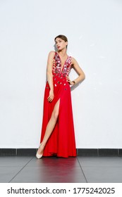 Beautiful Girl In Long Red Satin Dress Embroidered With Mirror Plates