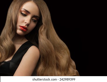 Beautiful Girl With Long Thick Shiny Hair On A Black Background. Curly Brown Hair. Red Lipstick