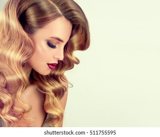 Beautiful girl with long wavy hair .  Blonde with curly hairstyle and red lips - Shutterstock ID 511755595