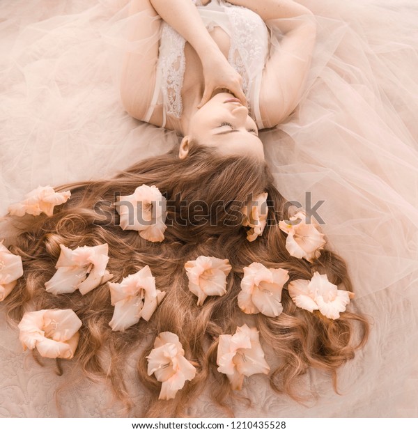 Beautiful Girl Lying On Bed Flowers Stock Photo Edit Now 1210435528