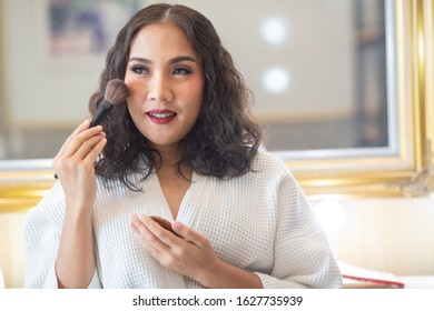 Beautiful girl makeup with her cosmetics. - Shutterstock ID 1627735939