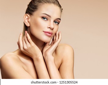 Beautiful girl with beautiful makeup on beige background. Youth and skin care concept