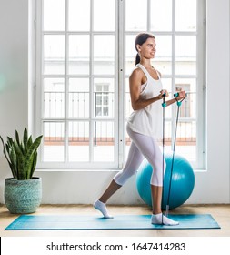 Beautiful Girl Making Training And Yoga At Home In The Morning