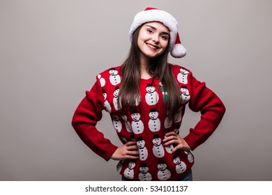 Beautiful Girl Model Wear Santa Hat And Christmas Sweater On Grey Background