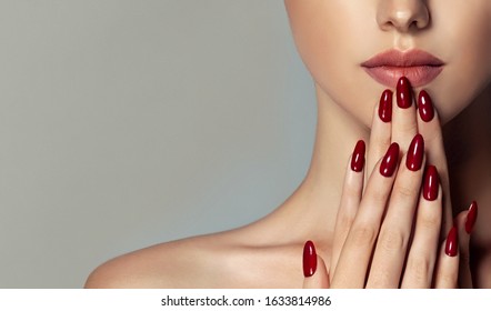 Beautiful Girl   . Model Woman Showing  Red  Shellac Manicure On Nails   . Cosmetics ,beauty And Makeup