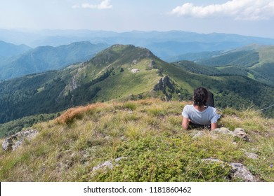 Beautiful girl in the mountains. An incredible view of the Troyan Balkan. The mountain captivates with its beauty, fresh air, a sense of infinity, coziness and tranquility.