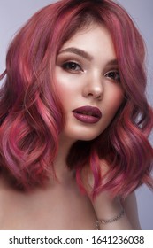 Beautiful girl and multi  colored hair   classic make  up   hairstyle  Beauty face  Photo taken in the studio