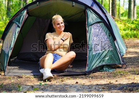 Similar – Image, Stock Photo Woman standing in ladder opening tent over car