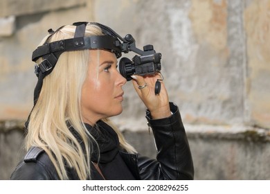 Beautiful Girl With A Night Vision Device, Side View.