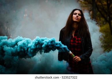 Beautiful Girl On A Background Of Colored Smoke