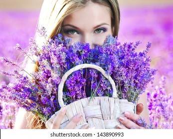 Beautiful girl on the lavender field 