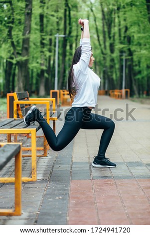 
beautiful girl on the street goes in for sports