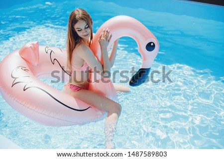 Beautiful girl on a vacation. Lady in the swimming pool