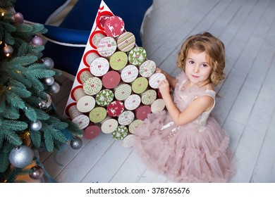 Beautiful Girl Opening Advent Calendar