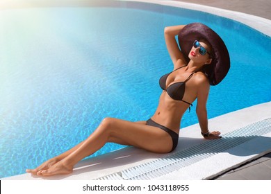 Beautiful girl in outdoor pool