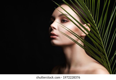 beautiful girl in palms. Beautiful woman with Make-up. Beauty Portrait. wild woman in Jungle.