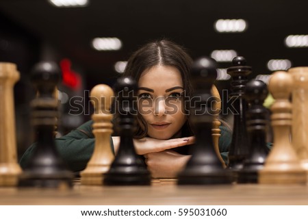 beautiful girl playing chess
