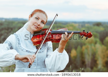 beautiful girl playing the violin