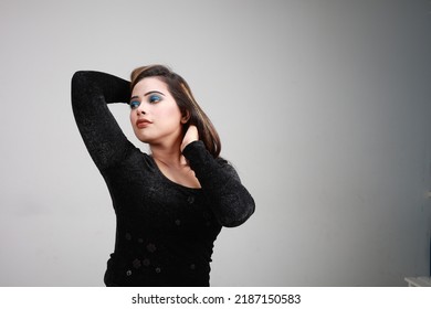 Beautiful Girl Poses Inside Studio With Make Up And Black Mini Skirt