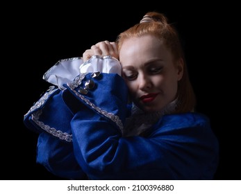 Beautiful Girl Posing In A Butler Costume On A Black Background