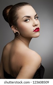beautiful girl punk with piercing, red lipstick and perfect skin