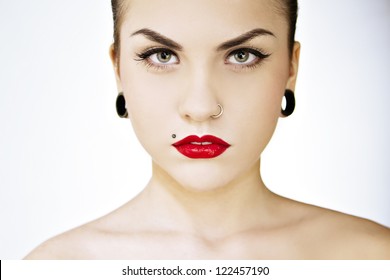 beautiful girl punk with tattu, piercing, red lipstick and perfect skin