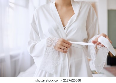 Beautiful Girl Puts On A White Wedding Robe