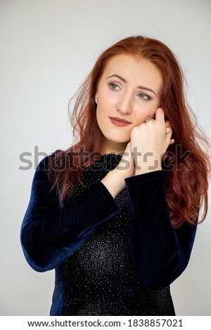 Beautiful girl red hair portrait close-up surprise