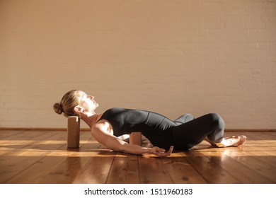 Beautiful Girl Relaxing Practicing Restorative Yoga