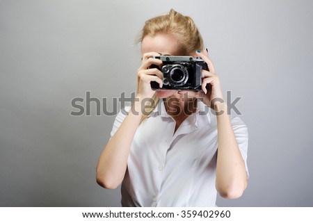 beautiful girl with a retro camera