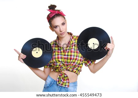 beautiful girl retro pin up style with vinyl records on white background
