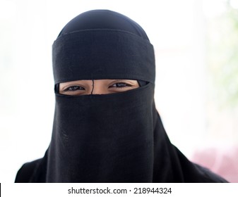 Beautiful girl with a scarf and black veil