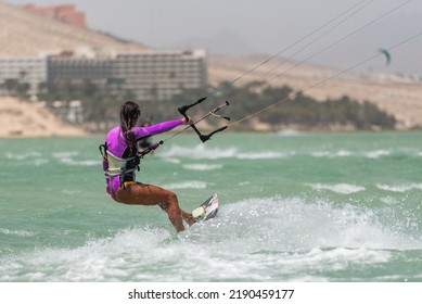 Beautiful Girl, Sexy Woman Kite Surfing Isolated In Fuerteventura, Canary Islands, Spain.