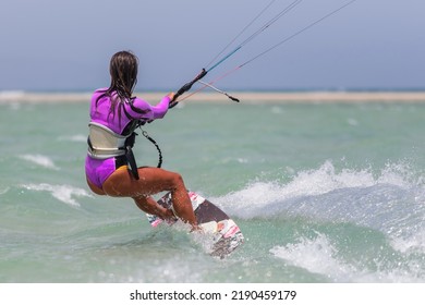 Beautiful Girl, Sexy Woman Kite Surfing Isolated In Fuerteventura, Canary Islands, Spain.