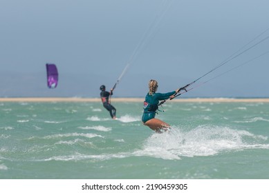 Beautiful Girl, Sexy Woman Kite Surfing Isolated In Fuerteventura, Canary Islands, Spain.