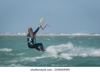 Beautiful Girl, Sexy Woman Kite Surfing Isolated In Fuerteventura, Canary Islands, Spain.