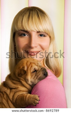 Beautiful girl with sharpei puppy