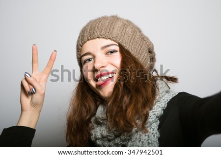 Similar – Young happy woman sticking out her tongue